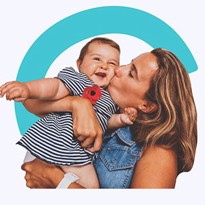 A mother holding her toddler