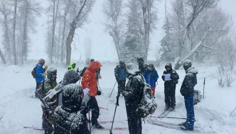 Photo of students in an outdoor class on skiis with lots of snow