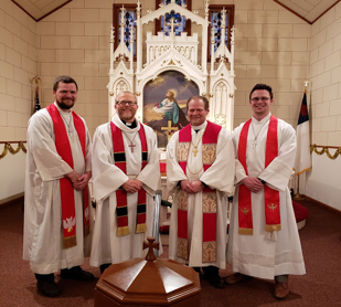 pastors gathered in front of church of John Merseth installation