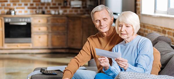 older couple reading on couch