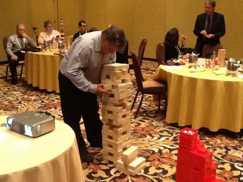 At our national sales meeting during EDS in May 2016, Electrocube sales reps and distributors take time for some creative play with Jenga and Legos like Joe Foresta of QRep� width=