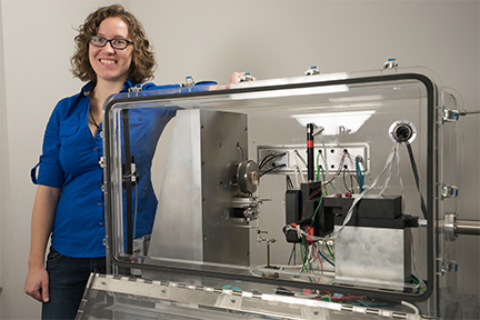 The most interesting thing about these materials is they function at temperatures above 500 degrees Celsius, says MIT graduate student Jessica Swallow, pictured with equipment used for testing new breathing materials. Courtesy of the researchers