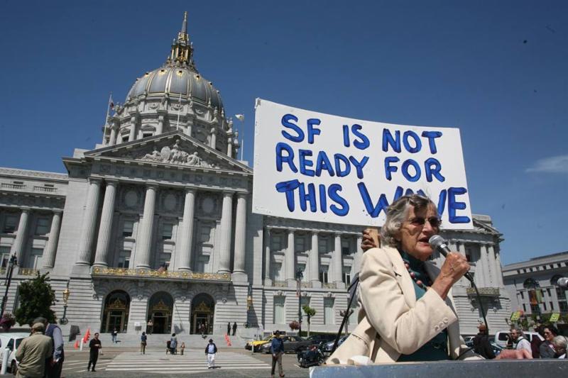 vera haile in front of sign that says SF is not ready for this wave